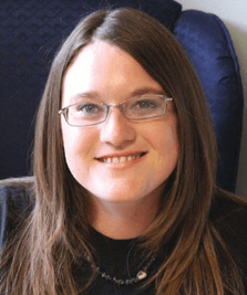 Spring-River-Area-Chamber-Guide-2024_page_9_12 Smiling person with glasses, long hair